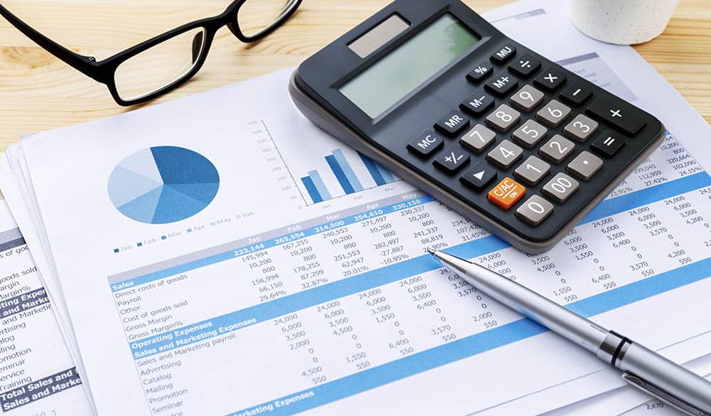 papers showing graphs and charts for small business accounting