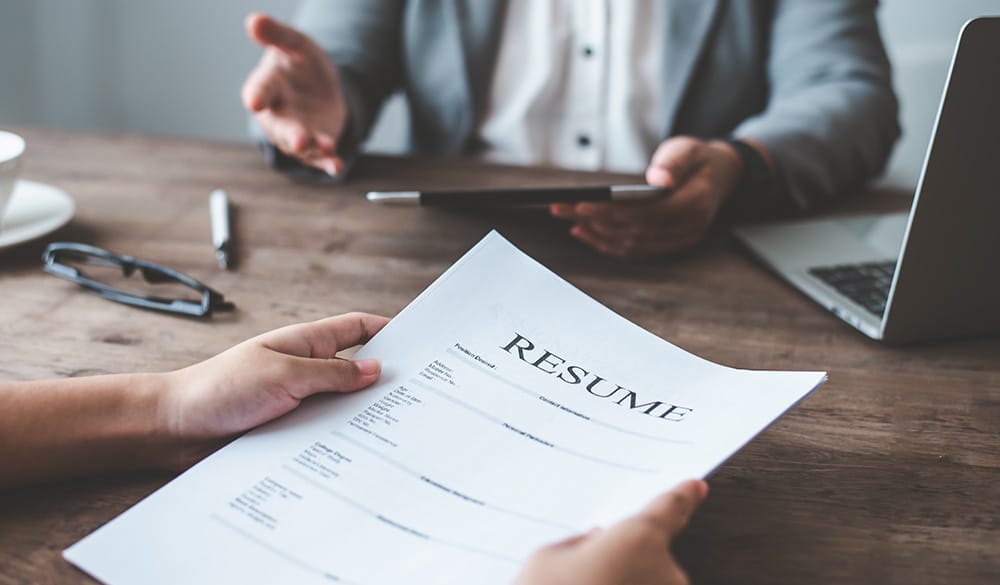 Job candidate holding resume during an interview